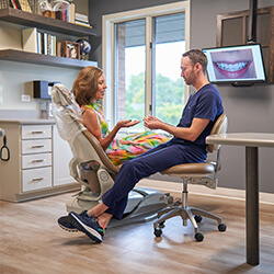 Dr. Hays performing an oral cancer screening
